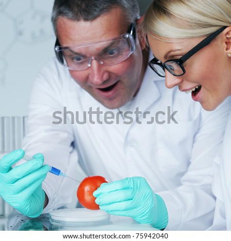 man and woman try to change tomato DNA