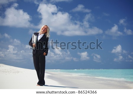 happy  business woman on the desolate ocean coast