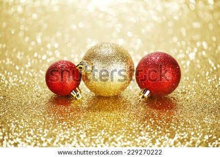 Three beautiful chritmas balls on shiny glitters