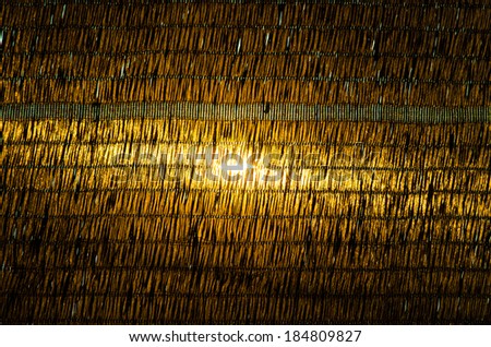 Sunlight behind black mesh filter light background