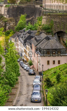 LUXEMBOURG CITY, LUXEMBOURG, April 27, 2014. Cars lined up alongside the houses on a steep road in Luxembourg