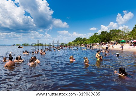 AMAZON, BRAZIL - CIRCA SEPTEMBER 2015: The Amazonians enjoying a hot and beautiful day on the beach in Amazon, Brazil