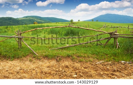 Old broken wooden fence in the mountains