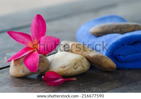 plumeria flower and Fabric with stone, concept of spa, treatment, relaxation and nature