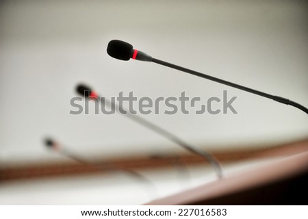 Detail with three press conference microphones