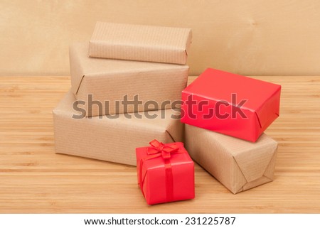 Group Of Wrapped Gift Boxes On Wooden Table.