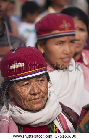 Chitwan, Nepal- December 26, 2013: Portrait of old woman wearing tradtional hat for a Cultural program during elephant festival, Chitwan 2013, Nepal