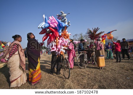Chitwan - December 29, 2013: Indian toys street seller during Elephant festival, Chitwan 2013, Nepal.