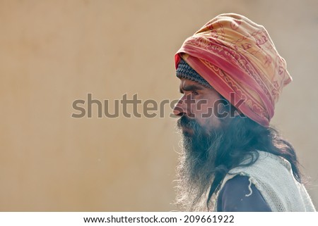Bardia, Nepal - January 15, 2014: Nepali brahman wearing long beard during Maggy festival in Bardia, Nepal