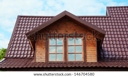 Dormer windows and roof of red tiles