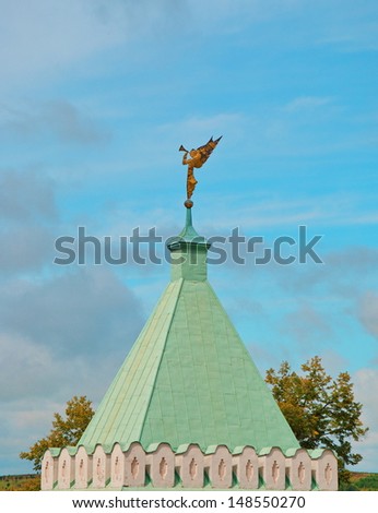 Fortress tower with a weather vane in the form of an angel