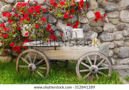 Garden flower arrangement and wooden carts