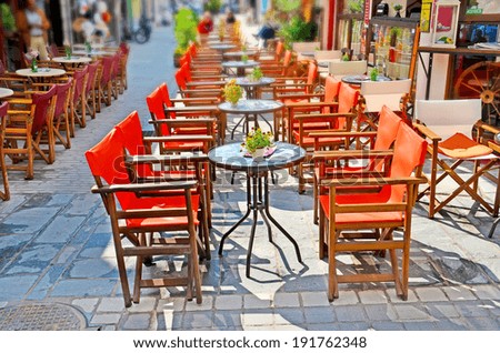 empty tables in greek coffee shop on the street. Ioannina - Epirus -Greece