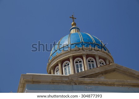 Syros island Greece - St. Nikolas church - blue background