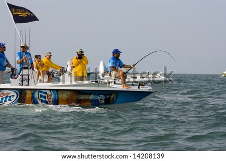 Boca Grande Pass, Florida - May 25: A team member fights the tarpon hard as he weaves in and out of boats and fishing lines.
