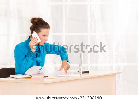 The woman emotionally talking on mobile phone. Telephone calls. She office employee or department head. Talking on the phone with a client about the affairs of the business. Answer the call.