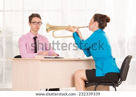 Communication between the client and the employee or office support services. HR manager conducts the interview. Woman screaming emotionally in copper trumpet. Afford to shout at him.