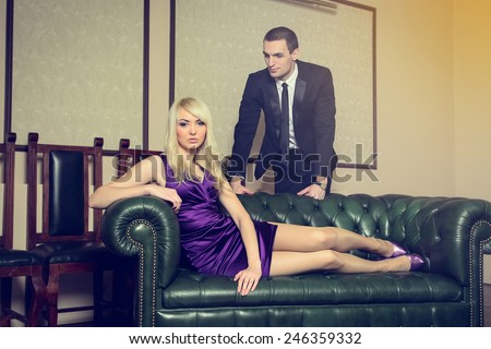 Romantic couple in a hotel room. Fashion portrait of young sensual couple. Lovely couple. Love story - a concept in the relationship between man and woman. Woman is a dream or entertainment of men.