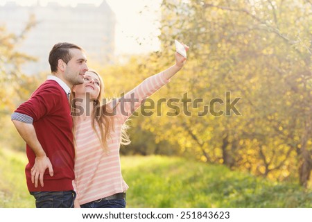 Loving couple together in a summer garden. Letters of love. Love story between a man and a woman. Walk in nature, as a lifestyle of modern people. Romantic Trips during the holidays.