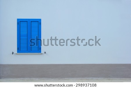 Blue window. Window with blue shutters on a gray wall. Background image for advertising. There is room for text. Space for ad text.