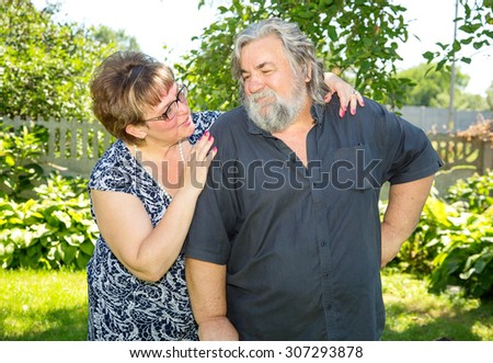 Happy and smiling old couple. Elderly seniors couple in park. Beautiful happy old people. Very adult man and woman.