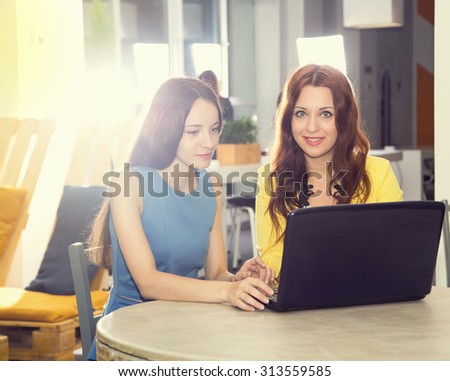 Interview. Two female office workers. Woman business. Meeting, discussion, joint work on the project. Staff of the office of women in the room for training. Two women working at the laptop computer