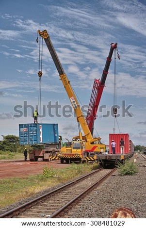 NONG KHAI, THAILAND - August 21, 2015: Crane Truck Loading Container to the Train for Shipping at Nong Khai Railway Station, Nong Khai, Thailand