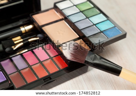 Set of cosmetics for the face. Set of eyeshadow, powder, brushes