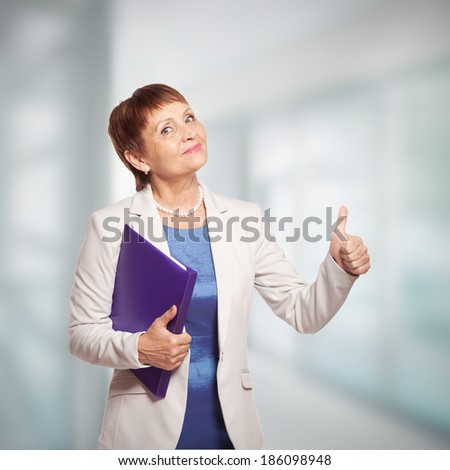attractive woman 50 years old with a folder for documents