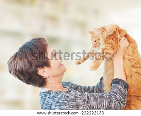 attractive emotional woman 50 years old with red cat