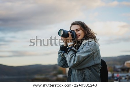 Similar – Foto Bild Junge Frau fotografiert Berge mit der Kamera