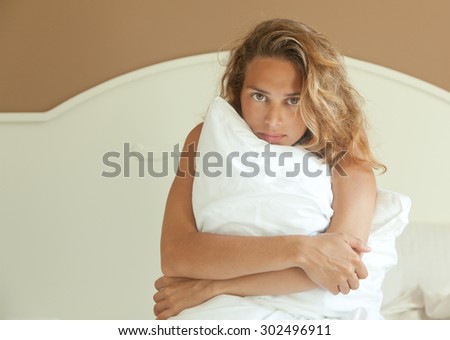 beautiful young woman on the bed, woke up in the morning