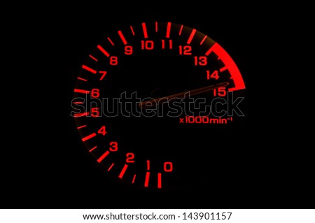 automobile tachometer on black background even faster