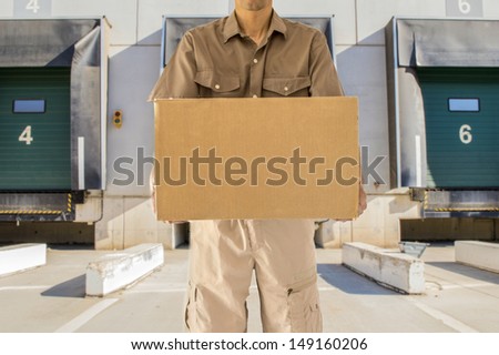 Man offering his goods transportation service from loading bay for trucks
