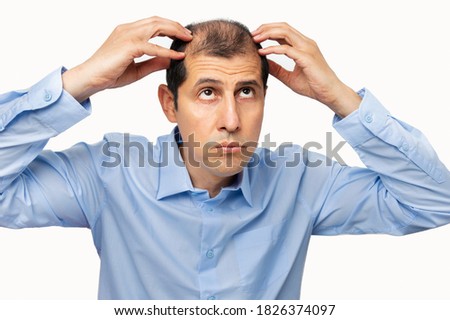 Similar – Image, Stock Photo Man touching the heads of wheat in a cultivated field