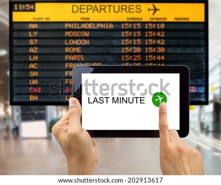 man search for last minute deals at an airport with your tablet