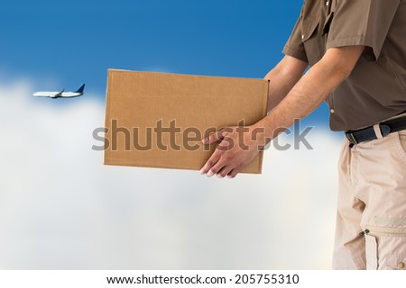 background of clouds and a cargo aircraft for air parcel delivery service