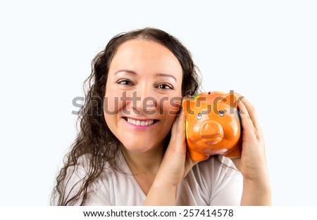 woman who loves her piggy bank savings with an orange pork