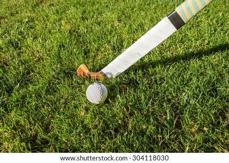 battle for control of ball during field hockey game