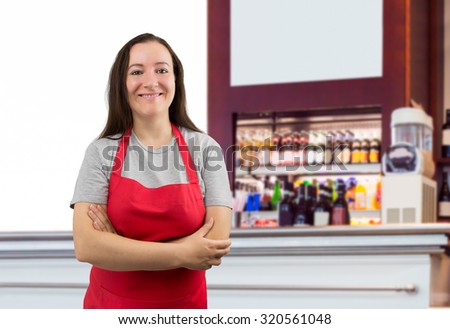 portrait of a saleswoman with crossed arms at the cafe