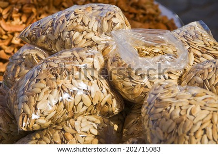 Roasted pumpkin seeds bags on a market