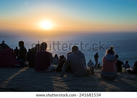 CAPE TOWN, SOUTH AFRICA - April 15: People enjoying the sunset at Signal Hill, a hill famous for its view on Cape Town city, on April 15, 2014 in Cape Town, South Africa.