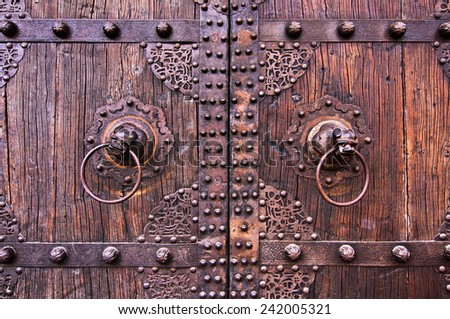 Metal and wooden ancient chinese doors with knockers