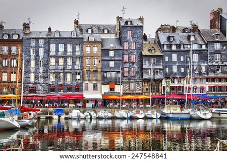HONFLEUR, FRANCE - APRIL 8: The old port of Honfleur, famous for having been painted many times by artists, on Aoril 8, 2012 in Honfleur, France