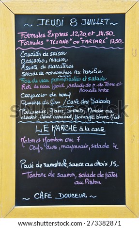 Menu written in French on the blackboard of a French restaurant