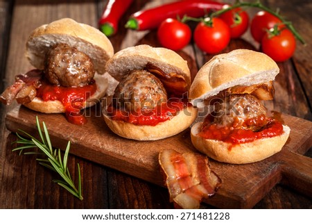 beef meatball sandwich on wooden board