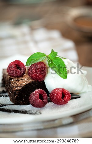 Chocolate brownie  with raspberry and mint