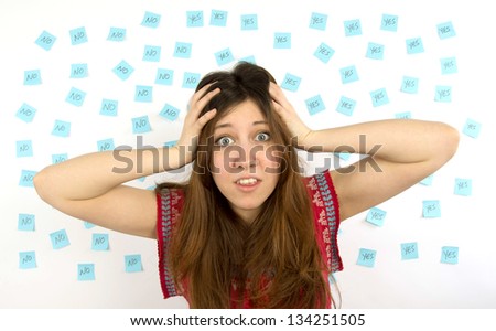 Young woman  with nose ring  with pink sticky notes and question mark thinking about decision making