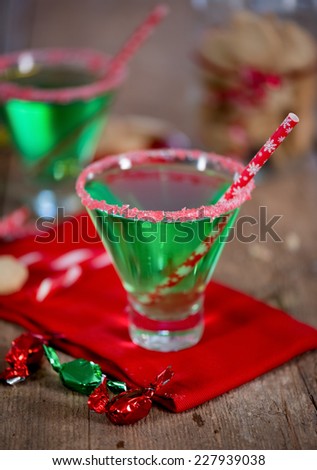 Christmas emerald green cocktail, glass rimmed with crushed candy cane. Great drink for entertaining.