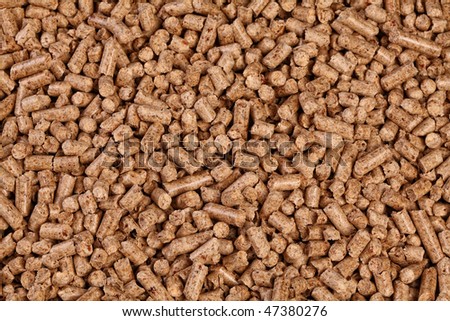 fine closeup image of natural wood pellet on white
